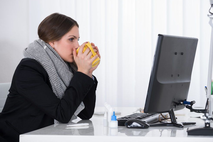 Woman cold in office